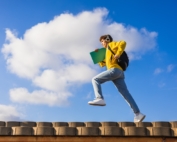 Teen Boy running on top of wall