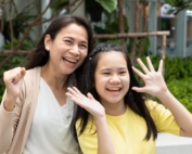 Mom with bright cheerful daughter.