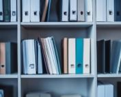 Shelves full of colorful binders.