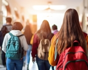 High school students walking in the school hallway.